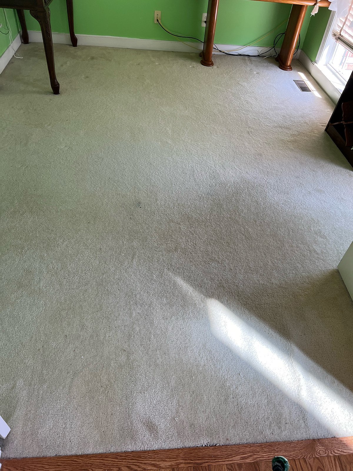 Soiled carpet in a Northern Virginia home before rug cleaning